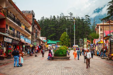MANALI, INDIA - SEPTEMBER 27, 2019: The Mall is a main pedestrian street in Manali town, Himachal Pradesh state of India clipart