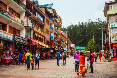 MANALI, INDIA - SEPTEMBER 27, 2019: The Mall is a main pedestrian street in Manali town, Himachal Pradesh state of India clipart