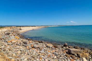 Beautiful empty beach in Algarve south coast, near Faro, Portugal
