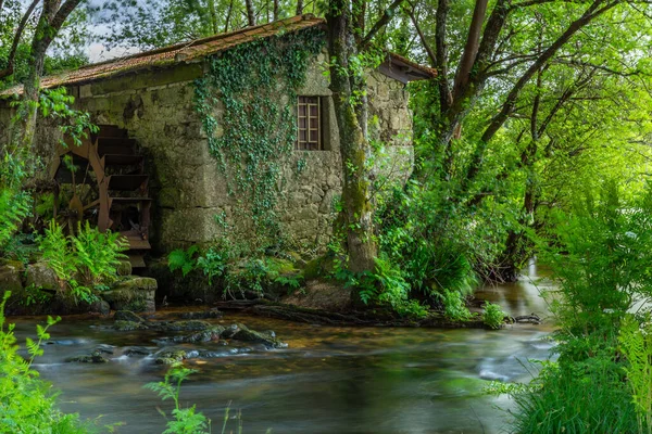 stock image Long exposure near an ancient watermill in Cavado river, Braga, Portugal