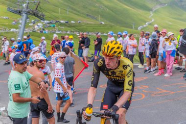 Col du Tourmalet, France: Nathan van Hooydonck climbig the road to Col du Tourmalet in Pyerenees mountains during the stage 6 of Le Tour de France 2023. clipart