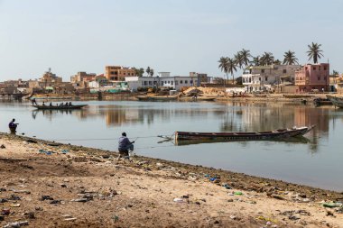 Saint Louis, Senegal: Fishing boats resting on the riverbank of the river Senegal