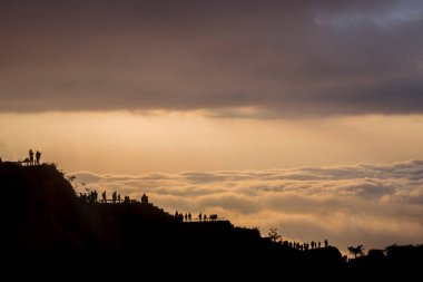 Scenic view of clouds and mist at sunrise from the top of mount Batur (Kintamani volcano), Bali, Indonesia clipart