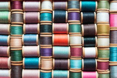 Multi-colored spools of thread close-up