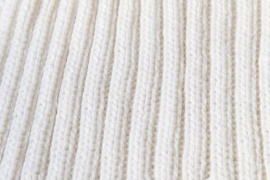 White knitted texture of woolen wool