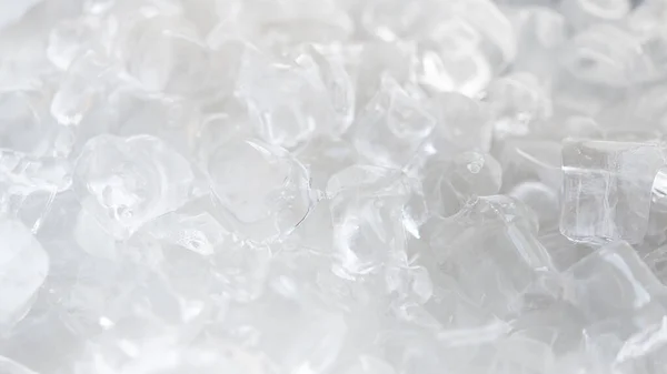 Crystal clear ice cubes as background. Food ice.
