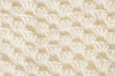 White knitted texture of woolen wool