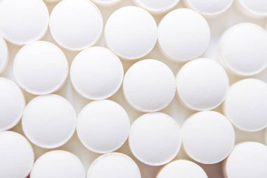  Scattered white pills isolated on white background. Model special offers as advertising, web background or other ideas. concept of medicine, pharmacy and healthcare. Copy space.