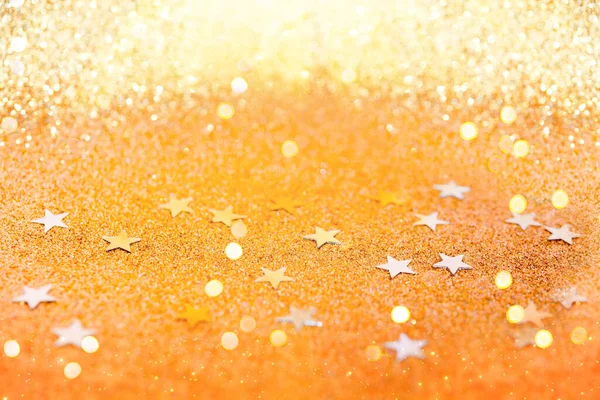 黄金の輝きのコンフェッティ抽象的な金の背景 黄金の星と豪華なクリスマスの背景 鮮やかな色のスパンコール グリーティングカード — ストック写真