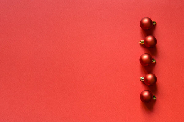 New Year's card. Christmas toys red balls. Flat lay with copy space. christmas holiday background. 