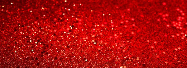 Kırmızı parıltılı konfeti soyut kırmızı arka plan, kırmızı yıldızlı lüks Noel arkaplanı. Parlak renkli pullar. Tatil tebrik kartı..