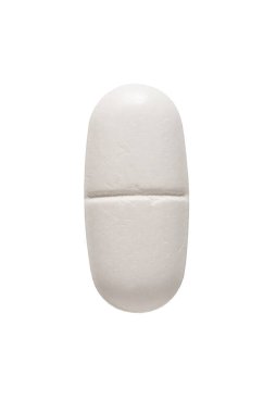 Beyaz arka planda izole edilmiş büyük bir beyaz oval tablet hapı. Antibiyotik.