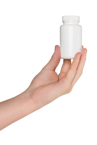 Hand holding blank mockup white jar of vitamins on white background, closeup. bottle of medication pills, isolated