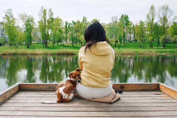 Woman Sits Pier Jack Russell Dog Pond Park Dog Sitting Jogdíjmentes Stock Képek