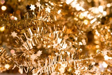 soyut parlak altın rengi arka plan, yıldızlı çelenk ve bokeh