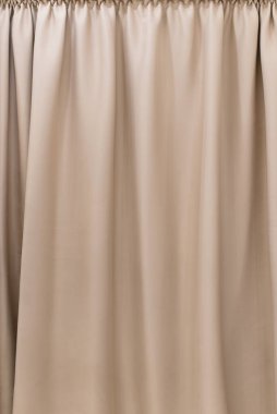 Bej perde kumaş dokusu ve arka plan. Büyük duvar perdesi. Otel sunumları için perde. Krem renkli kumaş..