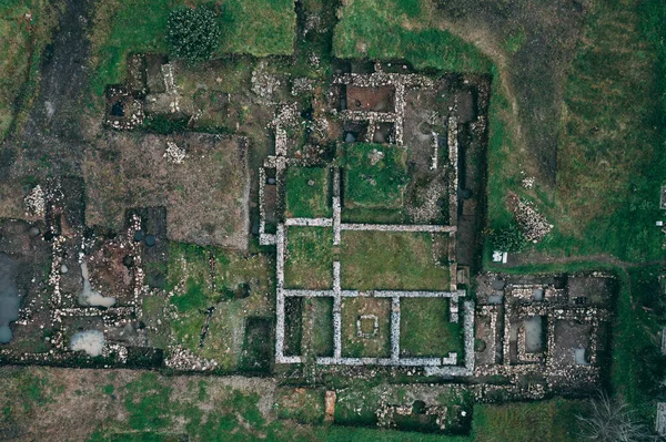 Archaeological excavations of ancient ruins, directly above drone view.