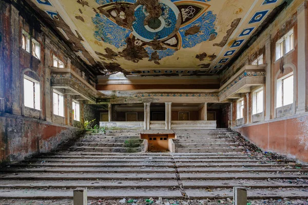 Old abandoned ruined stage theater or cinema hall.