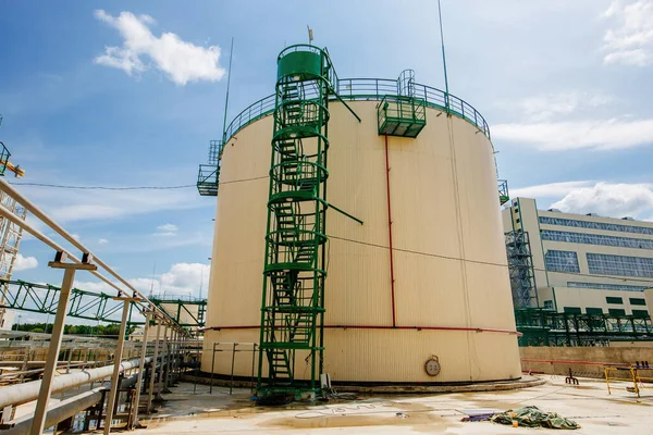 Large industrial round tanks for chemical production or oil. Construction of chemical factory