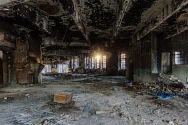 Burnt ruined industrial building. Consequences of war or fire concept.