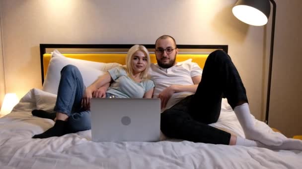Happy Relaxed Young Couple Lying Sofa Watching Film Photos Series — Stok video
