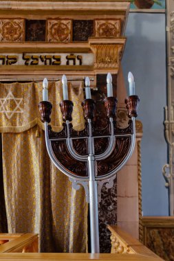 Electric Lamp Hanukkah Menorah inside synagogue.