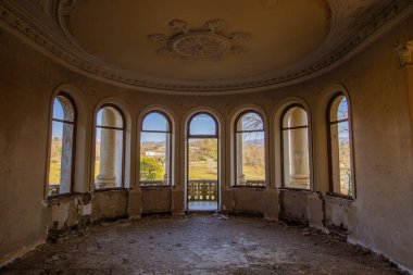 Large round hall with balcony old abandoned mansion.