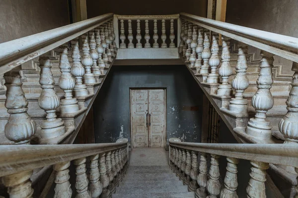 Old vintage staircase at the abandoned house or mansion.