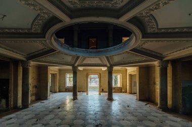 Entrance round hall at the abandoned house or mansion.