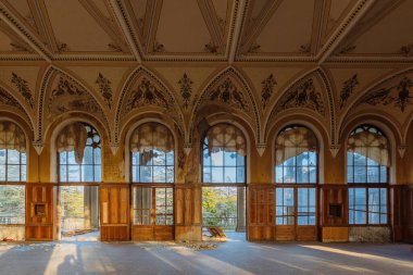 Large hall of abandoned building in gothic style.
