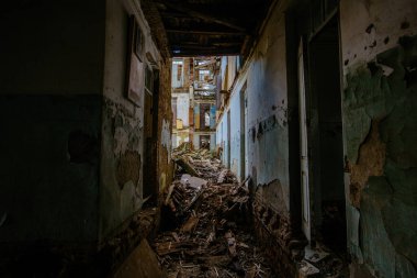 Ruined house interior destroyed by earthquake, bombing, war, explosion, etc. Consequences of accident and disaster concept.