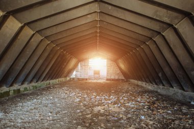 Old empty abandoned rusty metal industrial hangar