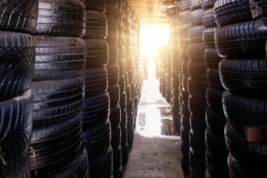 Stack of tires for sale in warehouse.