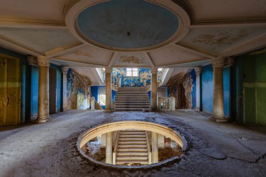 Entrance round hall at the abandoned house or mansion.