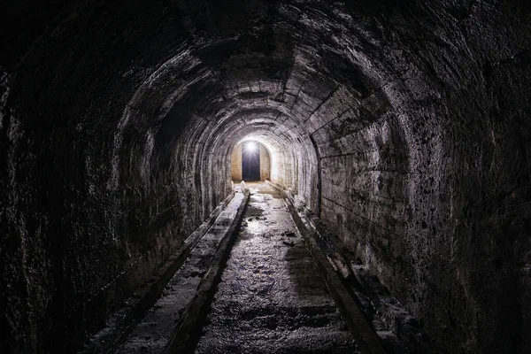 stock image Vaulted tunnel with concrete walls in old abandoned bunker, mine, drainage, subway, etc.