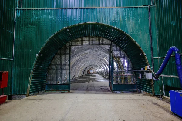 Dark large tunnel at old underground bunker.