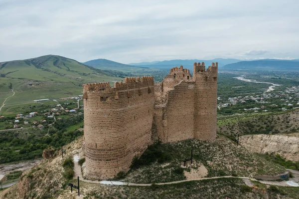 stock image Ancient old fortress. Mukhrani Ksani Castle ruin in mountains, aerial drone view.