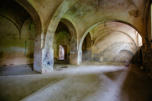 Old vaulted basement under abandoned castle.