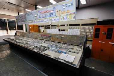 Control room. Large Industrial control panel inside factory or power plant. clipart