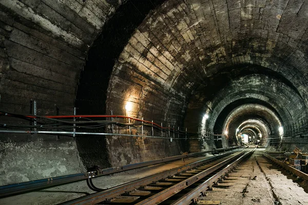 Round underground subway tunnel with tubing.