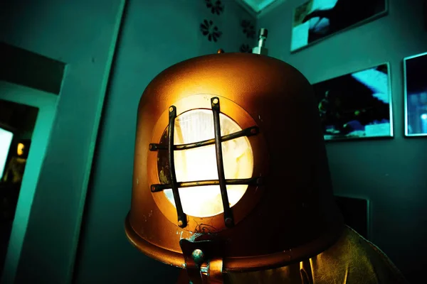 Old vintage copper diving helmet.