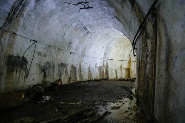Dark tunnel at old underground bunker.