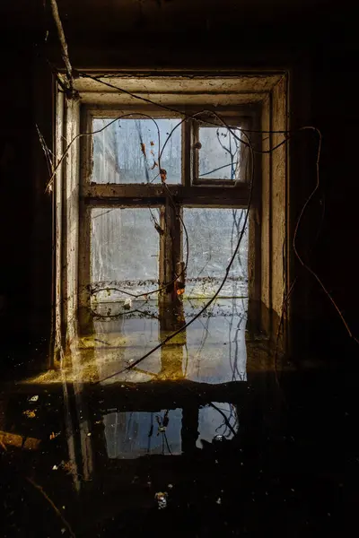 Flooded old house. Flooded old window. Natural disaster concept.