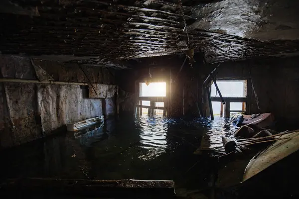 Flooded old house interior. Natural disaster concept.