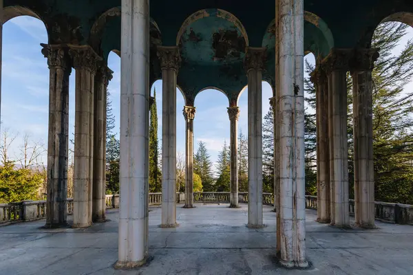 stock image Old colonnade in an abandoned palace. Former sanatorium Medea in Tskaltubo.