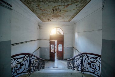 Entrance hall in old abandoned mansion.