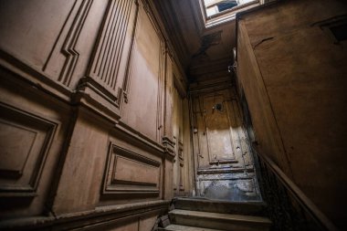 Entrance hall in old abandoned mansion.
