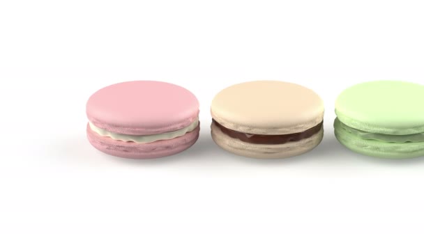 Sechs Französische Macarons Mit Verschiedenen Farben Und Geschmacksrichtungen Auf Weißem — Stockvideo