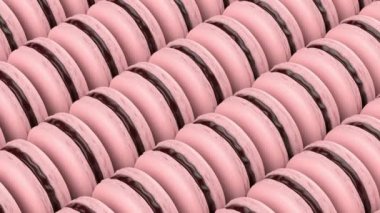 Many rows with pink french macarons filled with chocolate cream