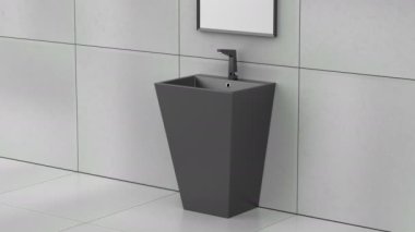 Banyoda siyah zemine monte edilmiş lavabo, sensör musluğu ve ayna var.